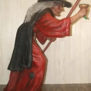 Statue d'une sorcière avec bâton et potion magique